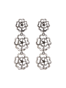 Macro detail of antique silver triple hollow rose earrings with dark zircon accents