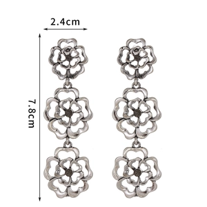 Retro hollow silver flower drop earrings with dark gemstones and layered bohemian design