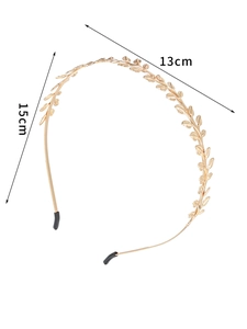 Detailed view of golden leaf headband showing 15cm height and 13cm width dimensions