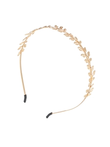 Detail of golden laurel leaf headband with anti-slip rubber tips on white background