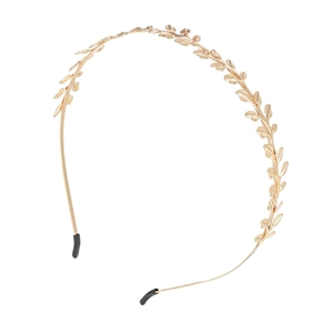 Minimalist golden metal leaf headband with intricate branch texture and comfort tips