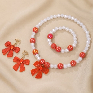 Handmade beaded jewelry set with red glitter bows and cream pearls for kids