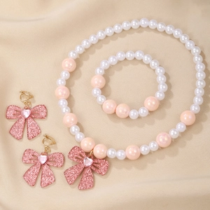 Cute beaded jewelry set with plastic pearls and pink glittery bow accents for girls
