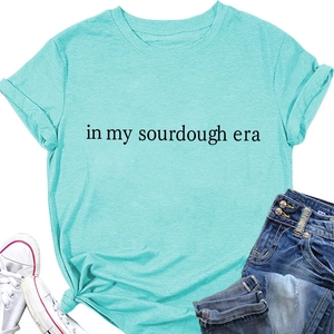 Flat lay of mint green sourdough era cotton T-shirt with denim jeans and sneakers