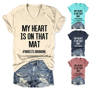 Detail of V-neck T-shirts with My Heart Is On That Mat slogan in four colors