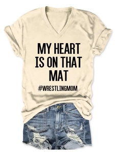 Close-up of V-neck wrestling mom T-shirt with My Heart Is On That Mat printed text