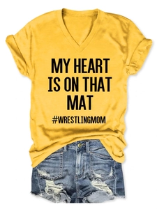 Detail of V-neck T-shirt with My Heart Is On That Mat text and distressed denim shorts