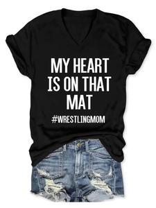 Flat lay of black V-neck T-shirt with My Heart Is On That Mat wrestling mom print