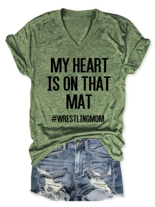 Detail of dark green V-neck T-shirt featuring MY HEART IS ON THAT MAT wrestling text