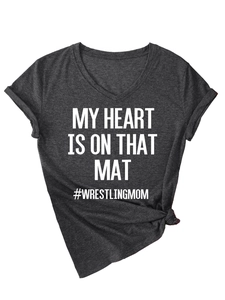 Detail of charcoal grey V-neck t-shirt featuring side knot hem and wrestling mom slogan