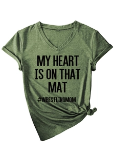 Detail of army green V-neck T-shirt with My Heart Is On That Mat text and side-knot hem
