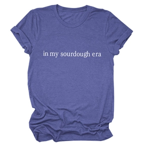 Detail of In My Sourdough Era white lettering on heather purple cotton blend t-shirt