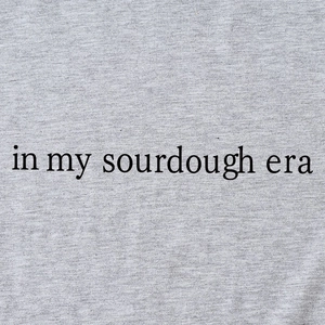 Classic grey knit cotton T-shirt featuring In My Sourdough Era black serif text print