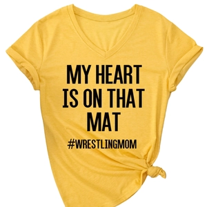 Women's V-neck bright yellow T-shirt with My Heart Is On That Mat slogan and knotted hem