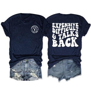 Detail of navy T-shirt with white art font typography and light blue denim shorts