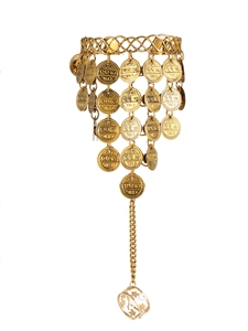 Detailed view of golden slave bracelet with coin charms and connected star pattern ring