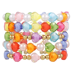 Colorful handmade beaded bracelet set with hearts and pearls for kids on white background