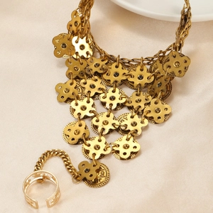 Bohemian gold layered belly dance hand chain with floral charms and vintage coins