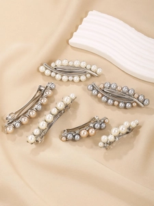 Detailed view of luxury 5-piece pearl hair clip set with gold alloy and sparkling crystals