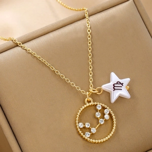 Close-up of golden Virgo zodiac necklace with sparkling rhinestone constellations