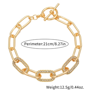 Detail view of gold alloy link bracelet with rhinestones and OT toggle clasp, 21cm long