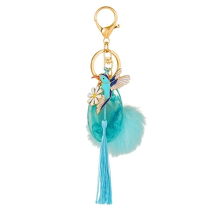 Teal hummingbird keychain with daisy pendant, plush pompom and silk tassel on gold hardware