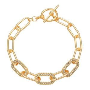Gold chain link bracelet with oval rhinestone charms and toggle clasp closure