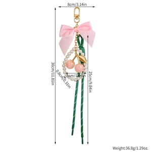 Detailed dimensions of cherry bow heart keychain pendant with pink ribbon and pearls