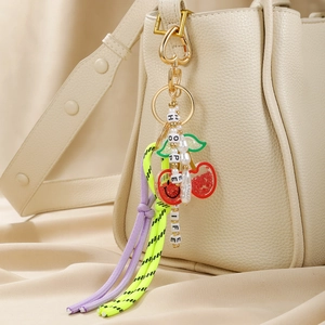 Fashion leather cherry and bow bag charm with HOPE and LIFE beads on a handbag