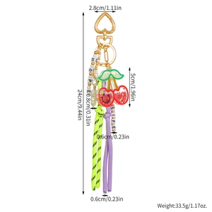 Detailed size specifications of the leather cherry and bow keychain with bead accents