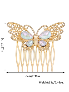 Vue détaillée d'un peigne à cheveux papillon doré montrant les dimensions 6x5cm et bijoux