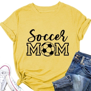 Flat lay of yellow Soccer Mom t-shirt with football graphic and casual outfit set