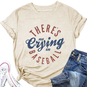 Flat lay of an apricot T-shirt with vintage baseball slogan and casual denim pants