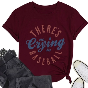 Flat lay of wine red cotton T-shirt with 'There’s No Crying in Baseball' print and jeans