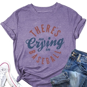 Detail of purple baseball graphic tee with knotted hem, blue shorts and white shoes