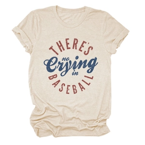 Close-up of vintage distressed lettering on the beige short sleeve baseball t-shirt