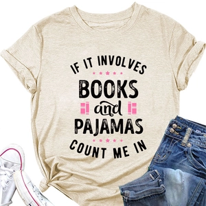 Flat lay of beige cotton T-shirt featuring books and pajamas print with casual denim jeans