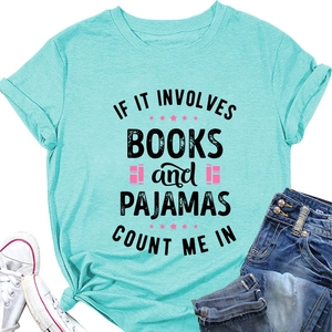 Mint green graphic t-shirt styled with jeans and white sneakers on white background