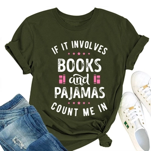 Detail of olive green t-shirt with books and pajamas quote print and casual flat lay