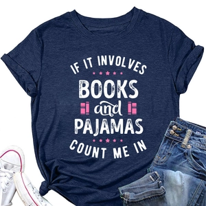 Flat lay of navy blue T-shirt with 'Books and Pajamas' print on white background