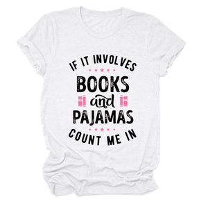 Close-up of white cotton T-shirt with 'books and pajamas' slogan and star icons