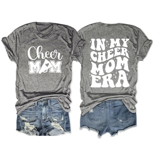 Detail of grey Cheer Mom T-shirts with white printed text and blue ripped denim shorts