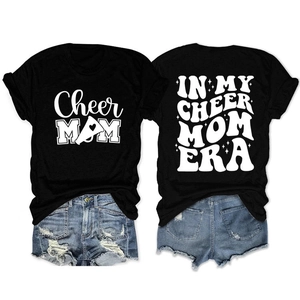 Black round neck t-shirt with Cheer Mom print paired with blue distressed denim shorts