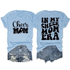 Detail of light blue t-shirt with Cheer Mom era print and distressed denim shorts