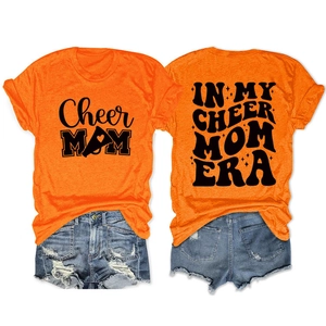 Front and back detail of orange Cheer Mom Era T-shirt with vintage slogan print