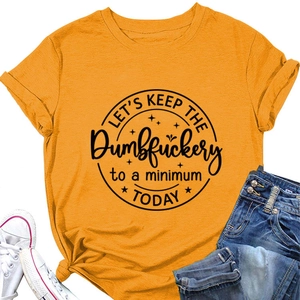Detail of a bright orange cotton T-shirt with black slogan print and rolled-up sleeves