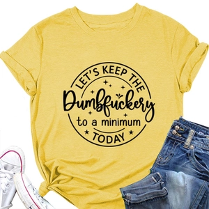 Flat lay of yellow cotton tee with text print, white sneakers and denim jeans