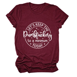 Close-up of Let's Keep the Dumbfuckery print on a burgundy cotton t-shirt fabric