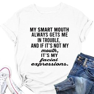 Flat lay of white crew neck t-shirt with black letter print and denim shorts