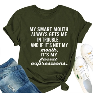 Detail of dark green cotton T-shirt with white slogan print and knotted hem design